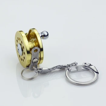 Mini Žuvų Varantys Keychain Aukso Skristi Žvejys Verpimo Charactor Miniatiūriniai Žvejybos Ritės Key Chain Automobilių Paketų Prižiūrėtojų Raktinę Priedai